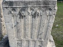 We saw a lot of this type of design and Edo said the long panels with a circle on the top represent how many children this person had. And when I say person, we are assuming it's a man.