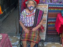 Beautiful Mayan woman outside her shop.