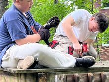 The grandsons hard at work, dismantling the pool deck.