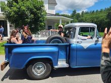 1956 GMC pu and grandkids tossing candy. 
