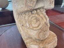 This was found at Ek-Balam.  It is a man, head, coming out of a serpent's mouth.  It's a Mayan myth that man was born out to the snake, or maybe the snake was eating us and thought we tasted like chicken?  Not sure.