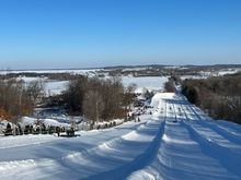 Tubing hill, from the top down. This is a typical Minnesota landscape, small farmsteads dotted among the white snowy fields