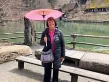 Hida Folk Village - lake and buildings beyond (parasols were available and I couldn't resist the pink!)