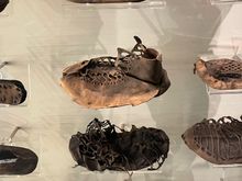 Lot's of shoes.  They were pressed down into mud and then had layers of dirt on top helping to keep them intact.