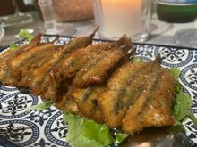 Crispy anchovies with nero d'Avola reduction 