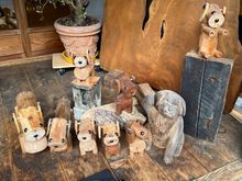 Wood carving pet family - near entry way of Enkayo 