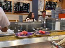 Food comes round on a conveyor belt and you just grab!