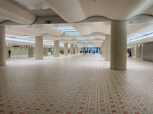  This gives you an idea of how massive the under carriage of the train stations.  I ducked down some stairs to get out of the rain, and suddenly I'm in this spotless area, you can't call it a hall, it's too big.