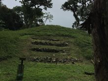 An ancient Lenca mound, with some stonework visible.