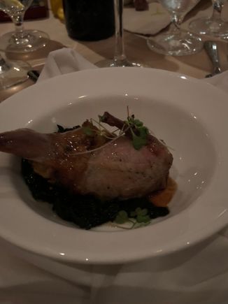 
stuffed quail on a bed of kale
