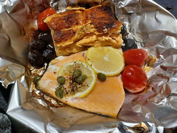 Salmon with black olives pan grilled cherry tomatoes, lemon and caper berries
