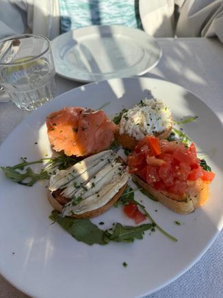 Our delicious cicchettis - a tomato bruschetta; the other 3 are all seafood - salmon, tuna and sardines