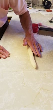 Rolling the dough into narrows strips