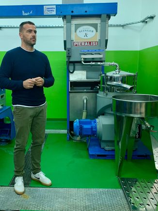 Tour of an olive oil factory which turns olives into olive oil very quickly.