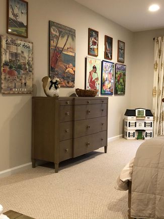 
Ottoman replace with bureau that is 40” high and could someday be used as a  convenient and back friendly changing surface for future grandbabies. Elaborate dollhouse in corner of room  also waiting for small persons to engage in play, DD approved that purchase so it is not ham-fisted attempt at message to García. 