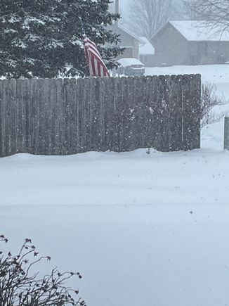 Snow. My neighbor’s flag makes a nice contrast. That’s their one and only flag! 