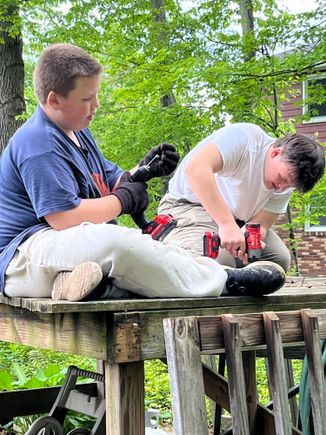 The grandsons hard at work, dismantling the pool deck.