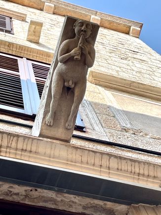Approaching the cathedral - I don't know what they are about but there are several of these figures on the buildings!