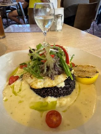 My dinner at the Port Campbell Hotel - grilled lemon pepper snapper with black rice, Asian salad and lemon cream sauce.