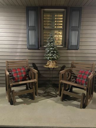 My side porch. Only Christmas stuff I’ve bought this year were these pillows. $5 each, Walmart—-and perfect I think. 