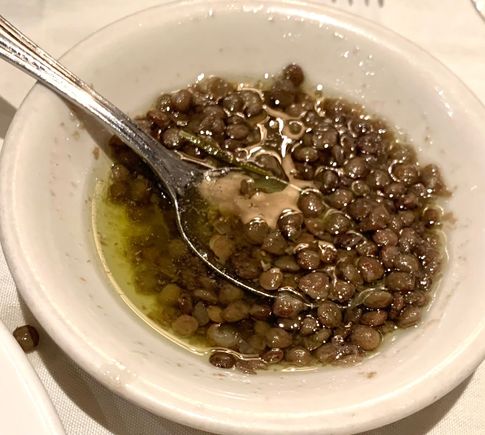The oil served with the bread had lentils in it