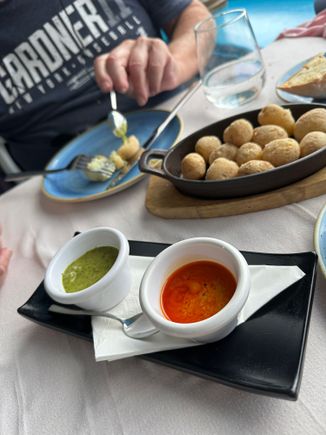 Patatas arrugadas, the celebrated "wrinkled potatoes" of Las Canarias.   Served with two mojos, the red and the green.   Not difficult to make, and later that week I was treated too a private lesson in making mojo rojo, and that was a highlight of the trip for me.  People could not have been kinder!