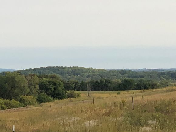 We are now getting some of the west USA fire smoke in Minnesota. The towers just over the tree line are 8 miles away. Usually you can see the Powder Ridge ski hill located 18 miles away but the smoke is blocking it. Still not bad air. The morning sun rise was spectacularly red today.