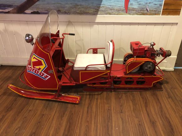 a replica of the earliest snowmobile.