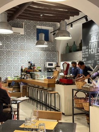 Casa lo Schiavo, interior; there are also tables on the pedestrian street