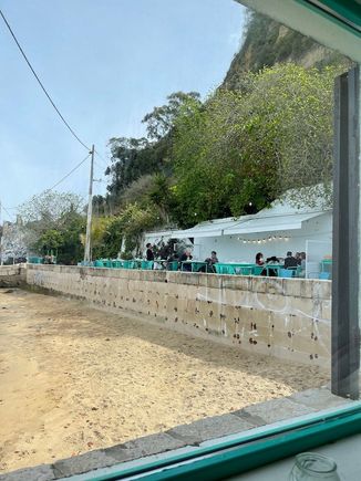 The terrace and its tiny beach