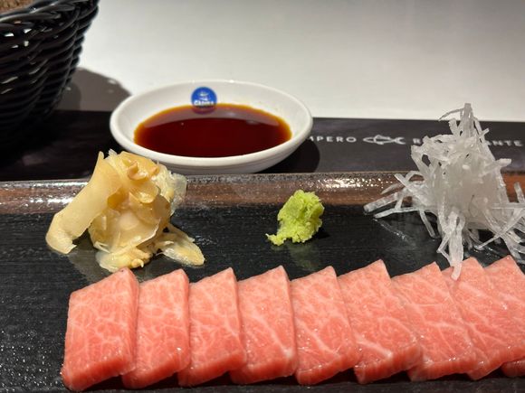 Half order of sashimi of bluefin tuna!!!!!!  Melt in your mouth!  One bit and ascend to gustatory paradise (ouch..sorry for that!!). 