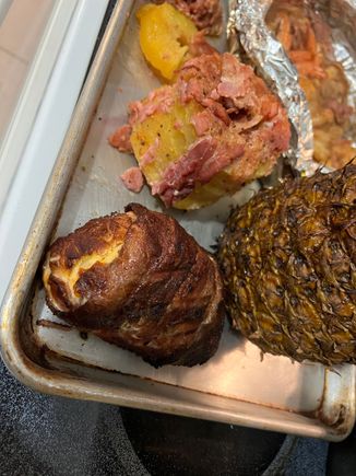 bacon wrapped chicken breast stuffed with cheese and broccoli. Bacon wrapped pinapple and shrimp and bacon in foil. The pinapple was the best of the bunch.