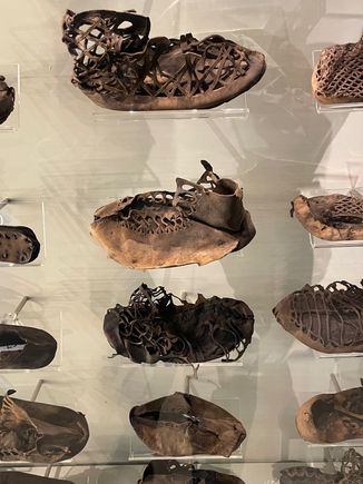 Lot's of shoes.  They were pressed down into mud and then had layers of dirt on top helping to keep them intact.