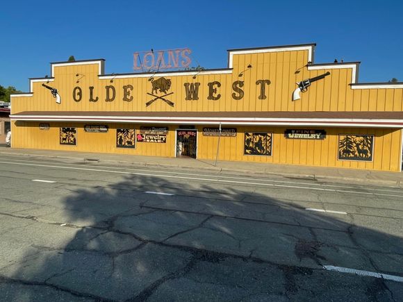Next store to Lim's was the Olde West pawn store. Big on guns, or so the sign says.