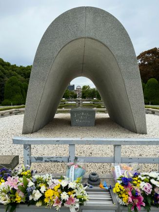 The Cenotaph for the Victims of the Atomic Bomb was built in 1952 in the Peace Memorial Park. Inside contains the names of all the known victims of the bombing, regardless of nationality. Names are added to these registries each year. The memorial is shaped like a roof, designed with the intent to shelter the souls of those lost to the bombing, and it is engraved with the words, "Let all the souls here rest in peace, for we shall not repeat the evil.”
