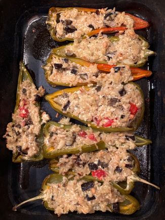 Delicious peppers which I ended up stuffing with brown basmati rice, onions, eggplant, garlic, ricotta, parmesan , toasted pine nuts and a little pesto.
First use of new oven since it has finally  cooled off today. 

These were the last of the peppers from our farmer as he, in a much higher elevation from us., has ha
