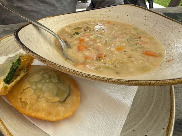 Barley soup with tutres (fried bread stuffed with spinach)