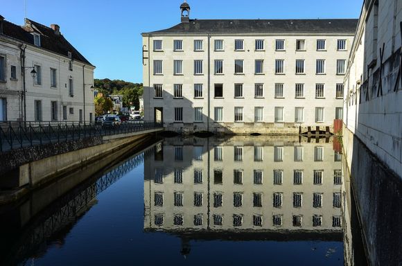 A historic clothing factory reflected in water. Loches has its own spa not far off from this spot.