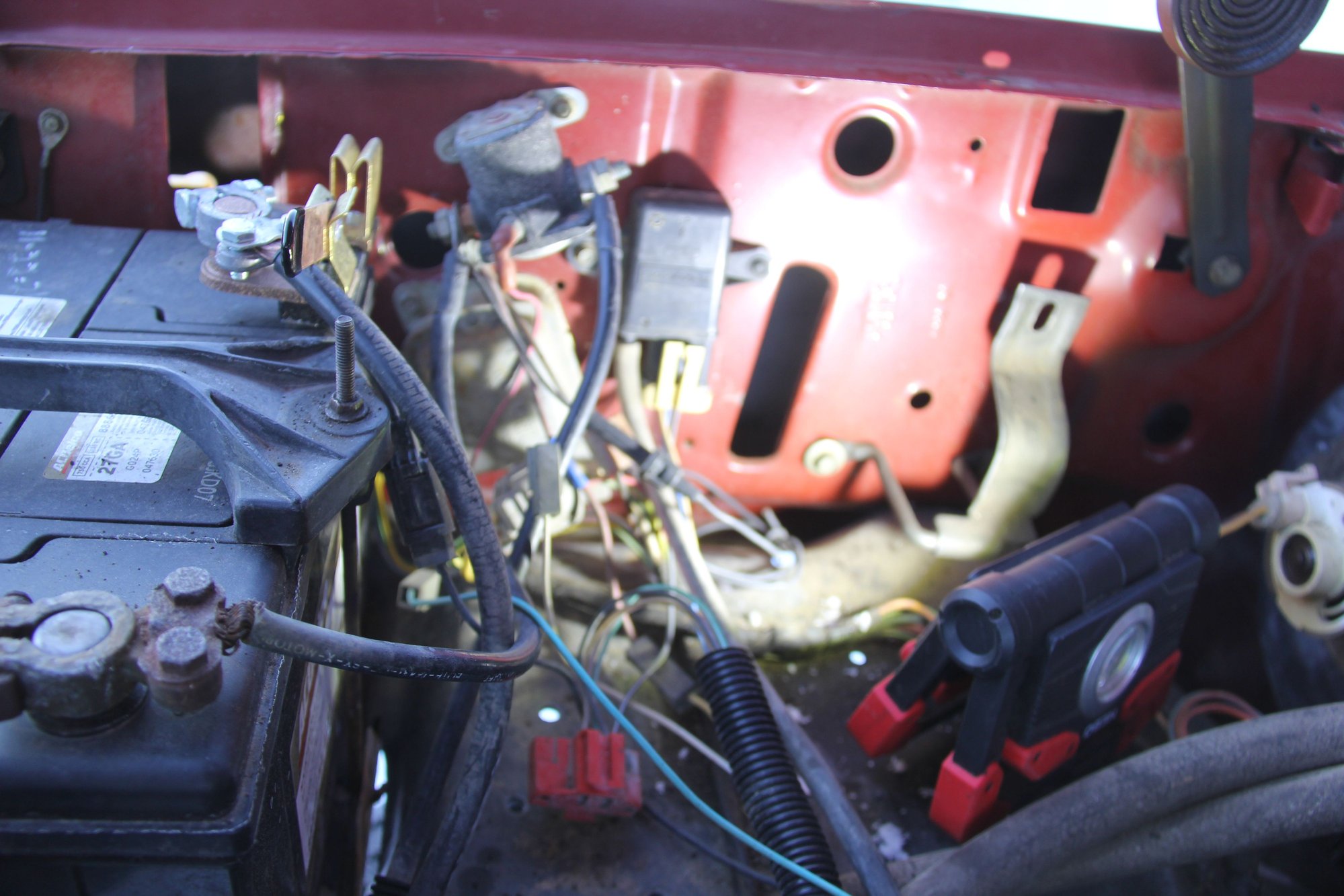  the black rectangular thing to the right of  the  starter solenoid  is the  manifold  absolute pressure  sensor  MAP