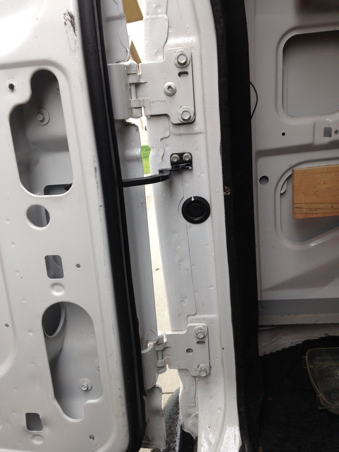 How do I adjust the rear doors on a E250 Cargo Van Ford Truck