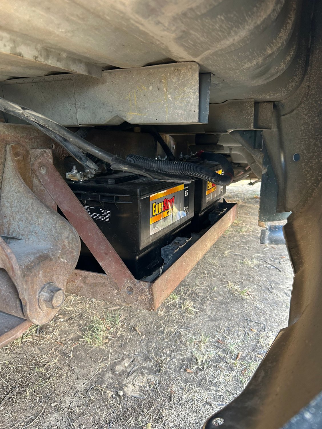 Passenger side frame rail location under bed.