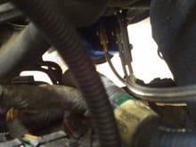Look down on the driver side near the Master Cylinder. The oil line traveling from below goes to the oil fill tube.