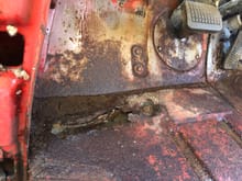 I couldn’t see the floor above the cab mounts due to the dirt and mouse bedding, but I could feel that they were gone. Getting the mat out, sweeping the loose debris  and pressure washing showed the area to be about as one might expect. 