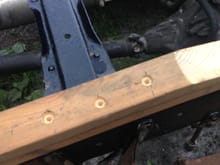 Holes drilled to clear rivets in the frame