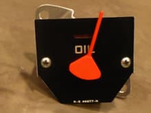 The oil pressure motor and needle fitted to the 54 F100 gauge face plate with a bracket made to mount it in the 54 instrument panel - front view