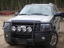 Wih H13 HID conversion kit - Pre Projector Install.
Tape on top of lights is stop some of the glare that was being reflected onto the ground right in front of the truck and killing my night vision...