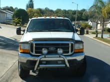Front view of my truck, I installed the cab clearance lights, bull bar, Hella fog lights, and tow mirrors