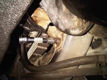 AC radiator support must come out to allow the leaf spring bolt to come out.
