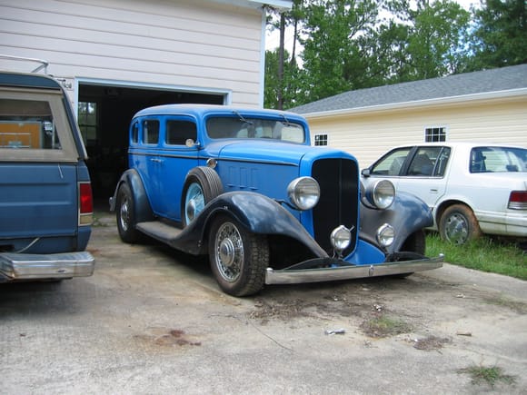 1933 Chevrolet, chopped/filled top, lowered headlights, six wheels and bustle trunk.