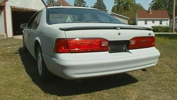 rear driver's side.  All red tail lamps.  Dual tailpipes.